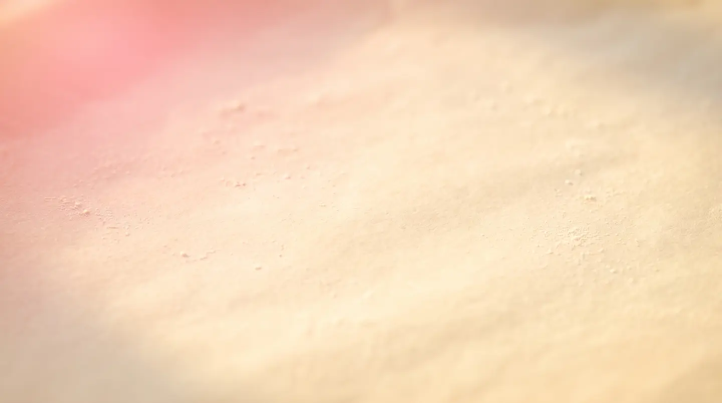 Cream baking parchment with a faint dusting of flour in warm light